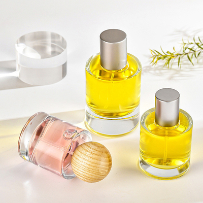 kupować Szklana butelka na perfumy 30ml 50ml Cylinder bagnetowy przezroczyste perfumy podpakiet kosmetyki butelka z rozpylaczem z drewnianą osłoną online manufacture